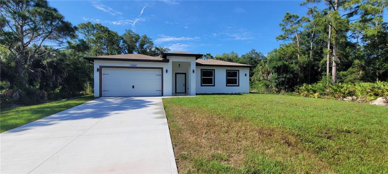 Front exterior of a new home in , Punta Gorda, FL, highlighting curb appeal (Image 18). Front exterior of a new home in , Punta Gorda, FL, highlighting curb appeal (Image 18).