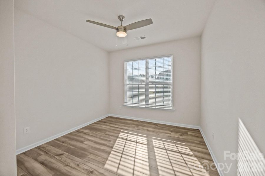 Office/Bedroom #1 with large closet is filled with natural light.  Upgraded contemporary ceiling fans throughout home.  Full bath just off this entry offset.