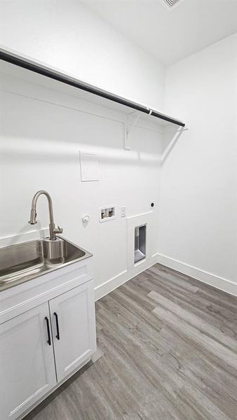 Laundry room featuring washer hookup, electric dryer hookup, cabinets, dark hardwood / wood-style floors, and sink