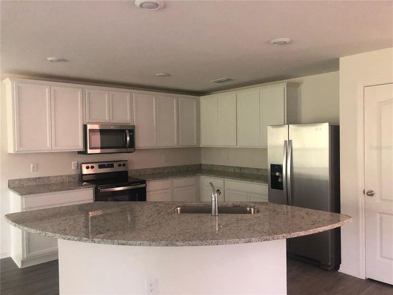 Furnished interior view inside a new home in , Kissimmee (Image 10).