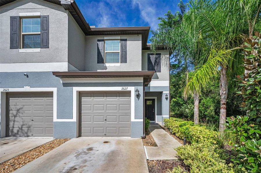 Front exterior of a new home in , Holiday, FL, highlighting curb appeal (Image 24).