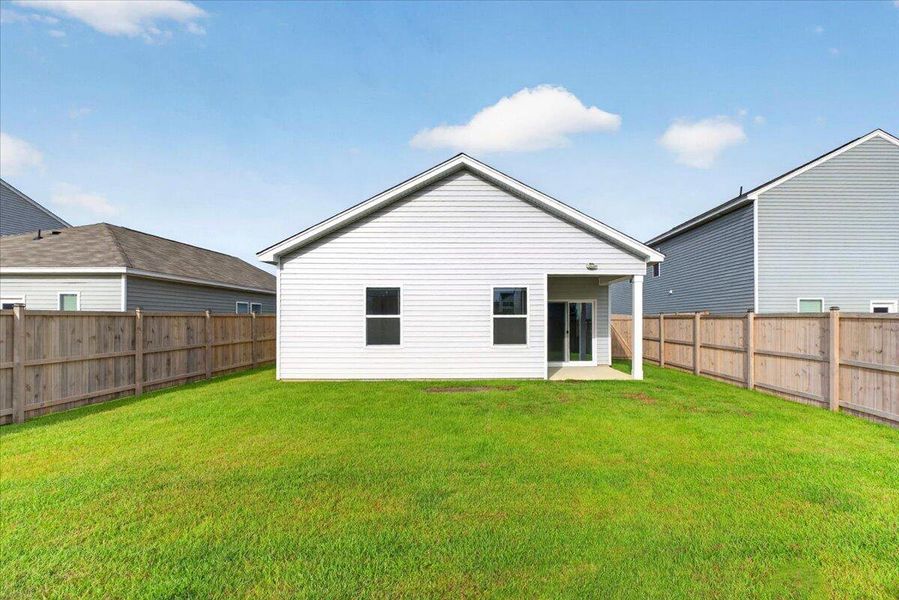 Exterior details and patio area of a home in Pender Woods at Cane Bay, Summerville (Image 3).