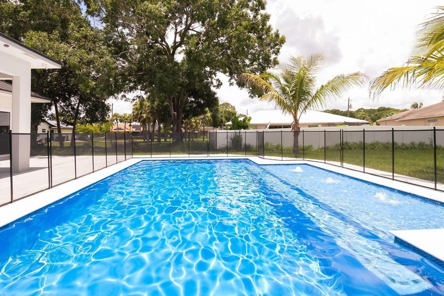 Front exterior of a new home in , Port St. Lucie, FL, highlighting curb appeal (Image 2).
