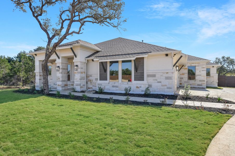 Representative exterior photo of a completed home built from the Sapphire by Giddens Homes in Riverstone, Georgetown, TX (Image 27).