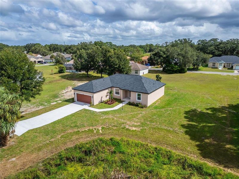 Front exterior of a new home in , Dade City, FL, highlighting curb appeal (Image 25). Front exterior of a new home in , Dade City, FL, highlighting curb appeal (Image 25).