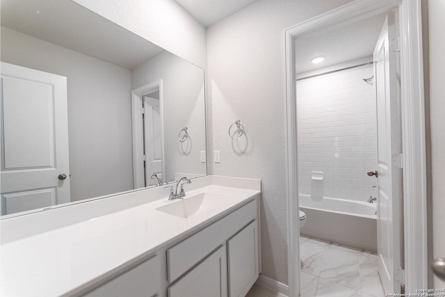 Furnished interior view inside a new home in The Woodlands at Medina Hills, Mico (Image 3).