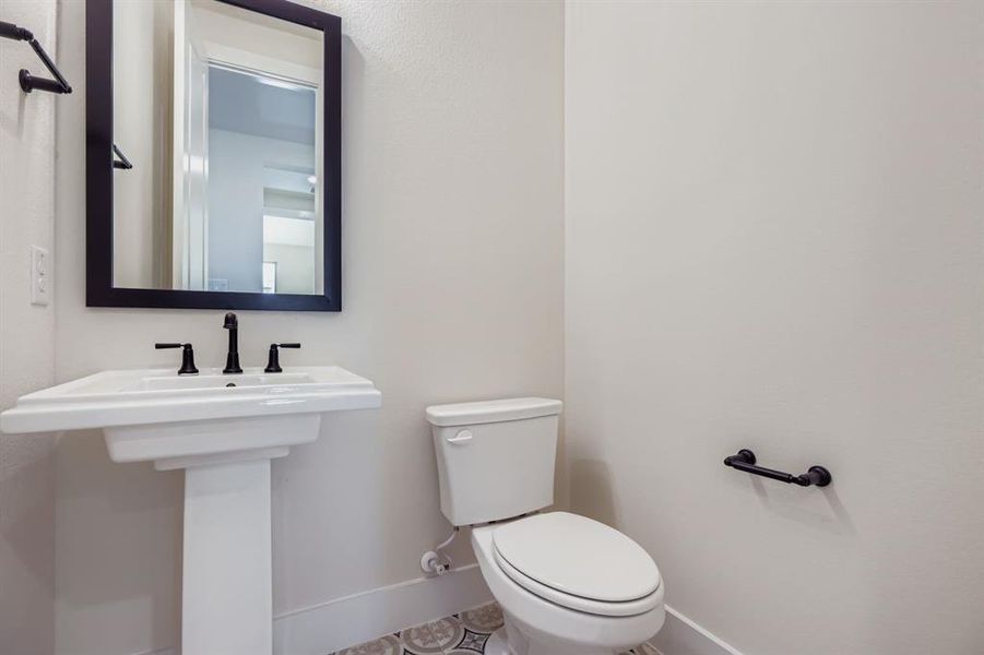 Bathroom featuring baseboards