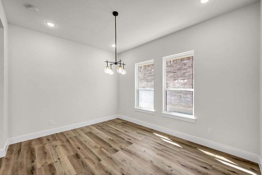 The dining room features plenty of warm, natural light.