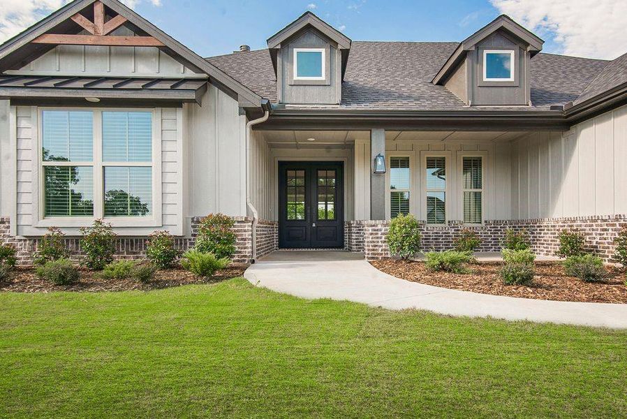 Front exterior of a new home in , Sherman, TX, highlighting curb appeal (Image 17).