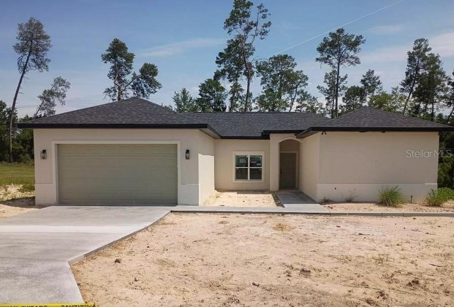 Front exterior of a new home in , Ocala, FL, highlighting curb appeal (Image 1). Front exterior of a new home in , Ocala, FL, highlighting curb appeal (Image 1).