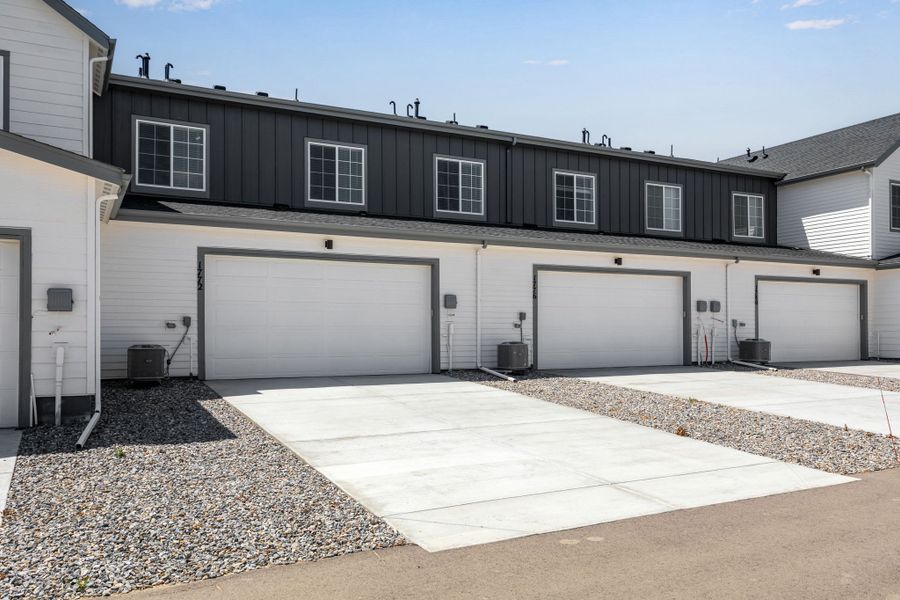 Front exterior of a new home in Westside Crossing, Berthoud, CO, highlighting curb appeal (Image 21).