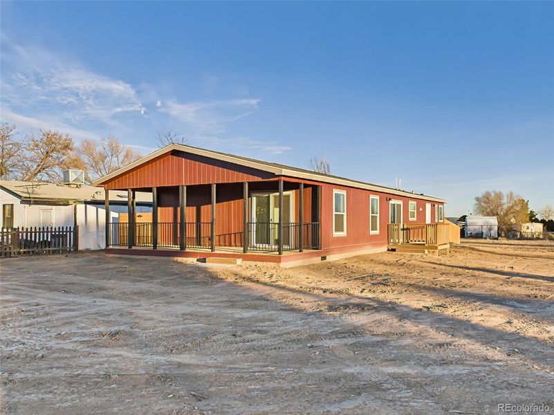 Situated at the end of a cul-de-sac, this new home features a welcoming covered front porch and plenty of space for parking and future landscaping.