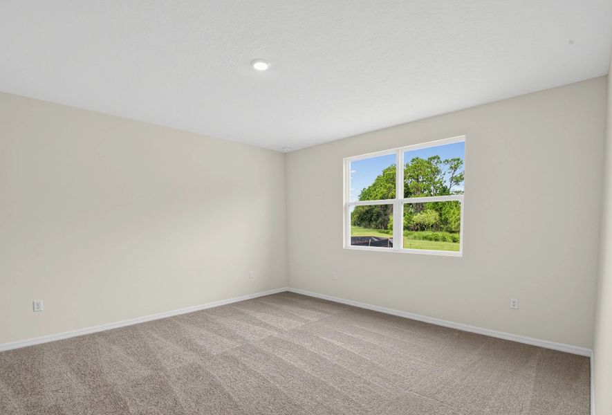 Spacious, unfurnished interior of a new home in Ardisia Park, New Smyrna Beach (Image 22).