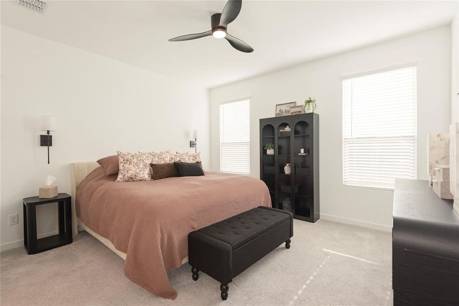 Spacious room featuring light-toned carpeting, two windows with blinds, and white wall finishes Spacious room featuring light-toned carpeting, two windows with blinds, and white wall finishes