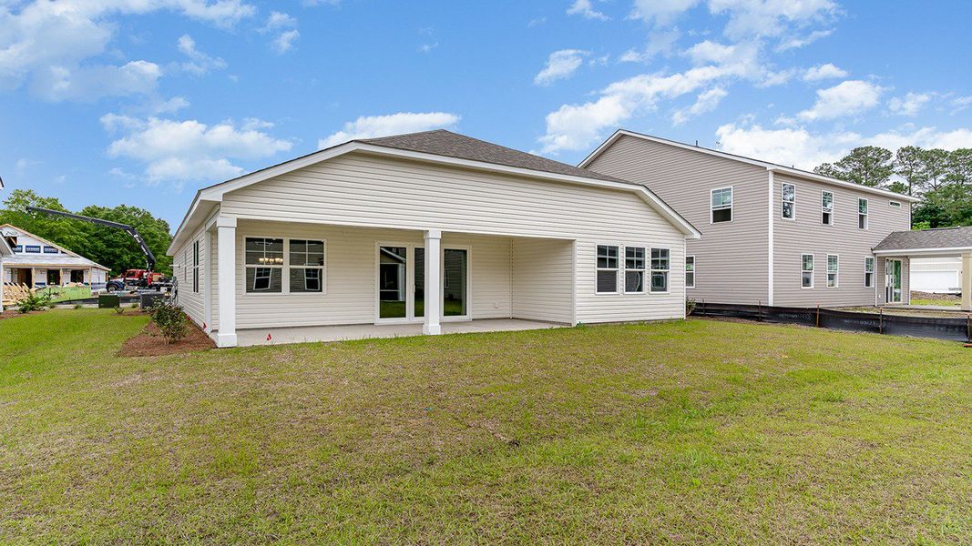 Representative exterior photo of a completed home built from the EATON by D.R. Horton in Spring View Landing, Loris, SC (Image 15).