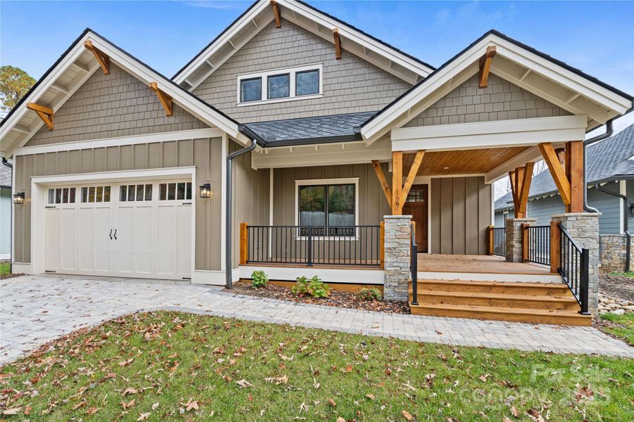 Front exterior of a new home in , Arden, NC, highlighting curb appeal (Image 1).