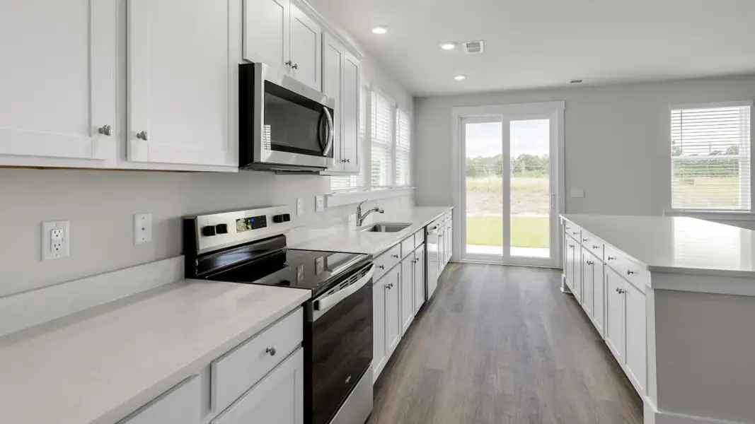 Furnished interior view inside a new home in The Highlands at Cedar Hill Landing, Navassa (Image 7).