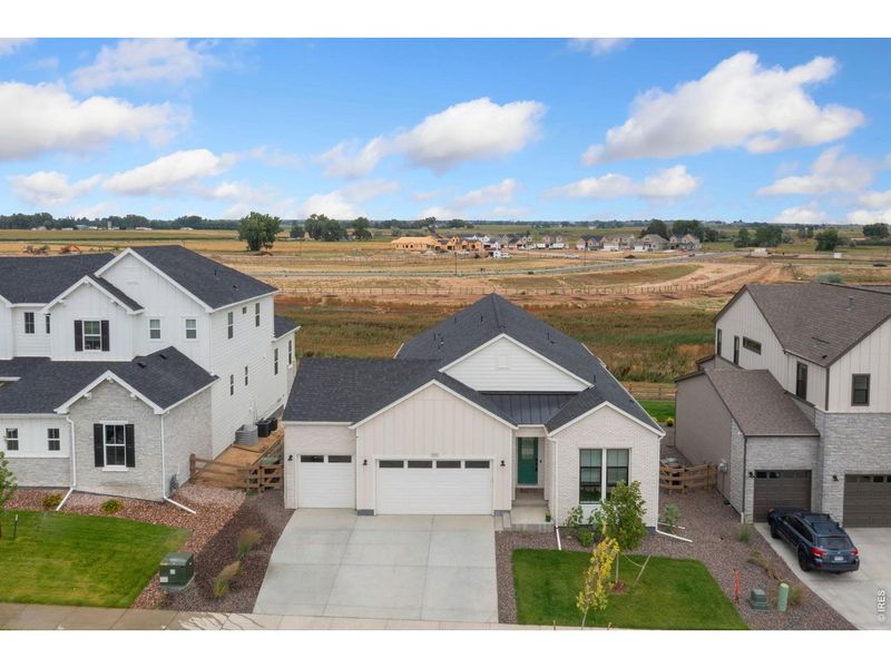 Front exterior of a new home in , Timnath, CO, highlighting curb appeal (Image 2). Front exterior of a new home in , Timnath, CO, highlighting curb appeal (Image 2).