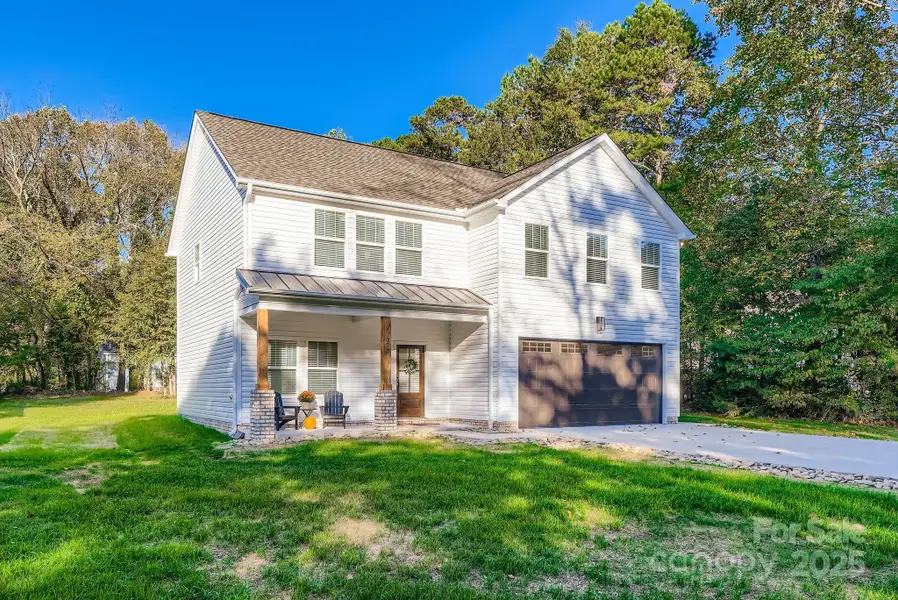 Front exterior of a new home in , Concord, NC, highlighting curb appeal (Image 1). Front exterior of a new home in , Concord, NC, highlighting curb appeal (Image 1).