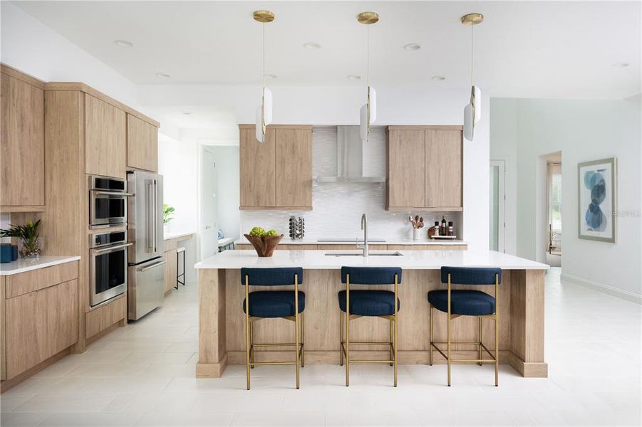 Kitchen of previously built Veranda Model home. Note: color selections and cabinet style may vary in this preconstruction home.