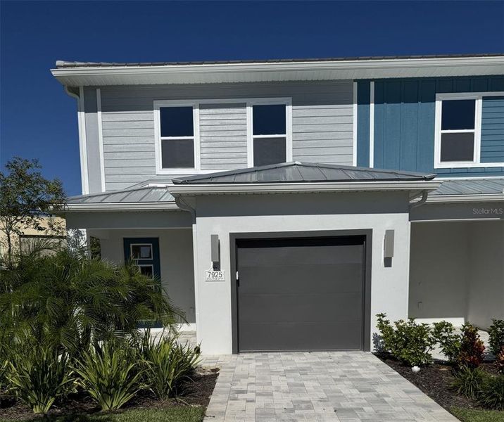 Front exterior of a new home in , Kissimmee, FL, highlighting curb appeal (Image 1). Front exterior of a new home in , Kissimmee, FL, highlighting curb appeal (Image 1).
