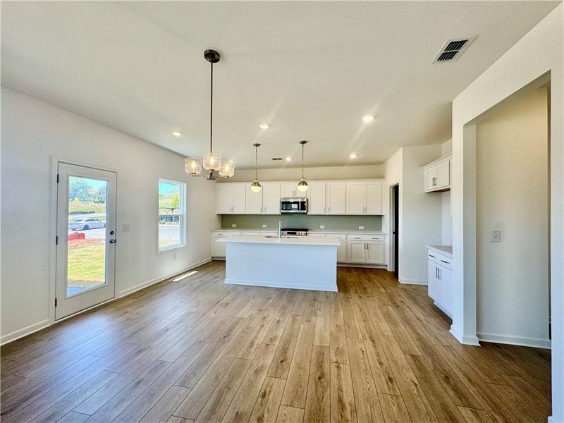 Spacious, unfurnished interior of a new home in Eastlyn Crossing, Flowery Branch (Image 12).