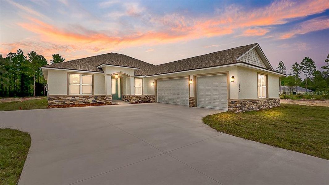 Front exterior of a new home in , Dunnellon, FL, highlighting curb appeal (Image 1).