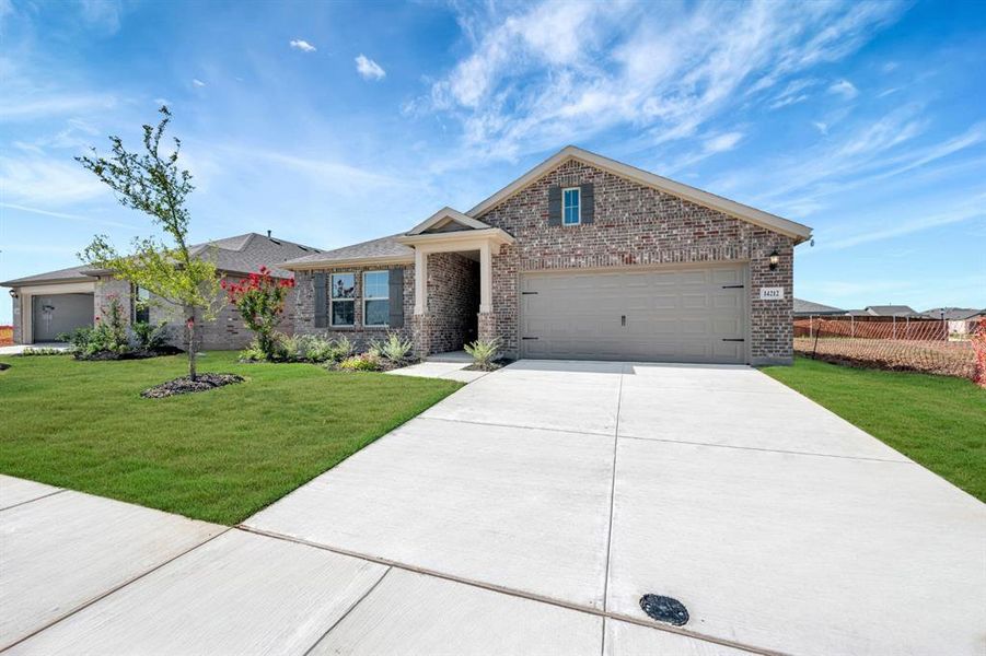 Front exterior of a new home in Mobberly Farms, Pilot Point, TX, highlighting curb appeal (Image 18).
