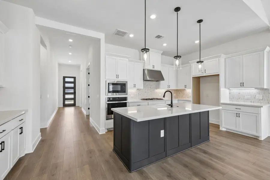 Representative furnished interior of a home built from the Guadalupe by Taylor Morrison in Eastwood, Manor (Image 6).