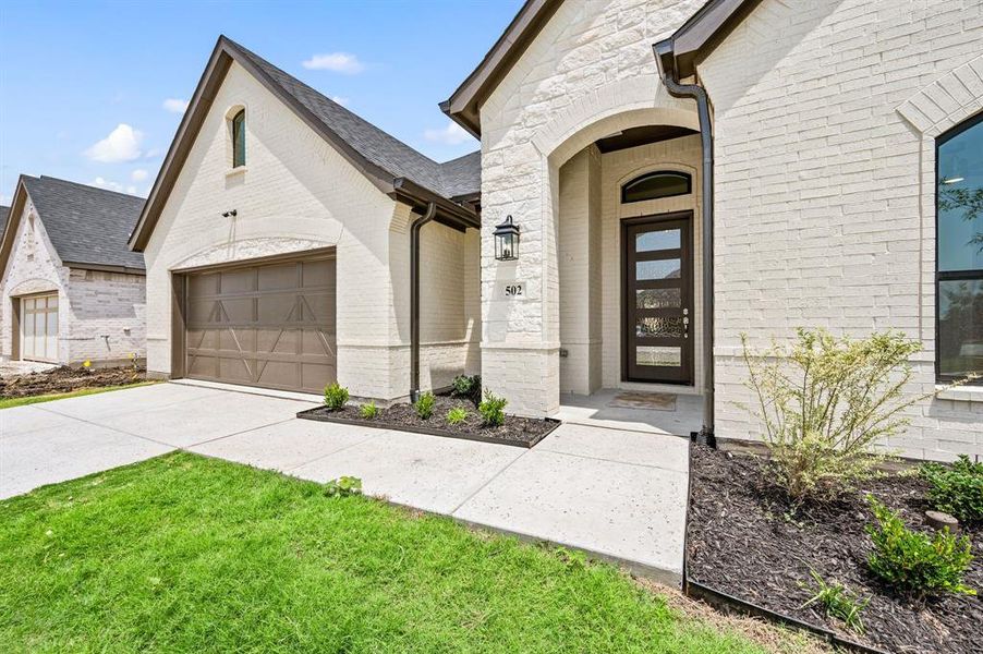 Front exterior of a new home in LeTara, Haslet, TX, highlighting curb appeal (Image 19).