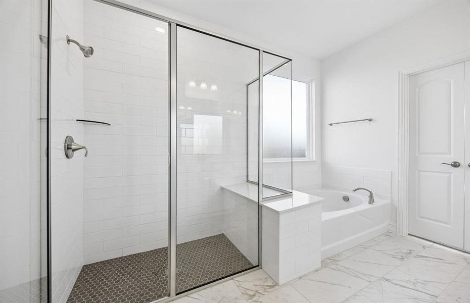 Primary bathroom with separate tub and shower
