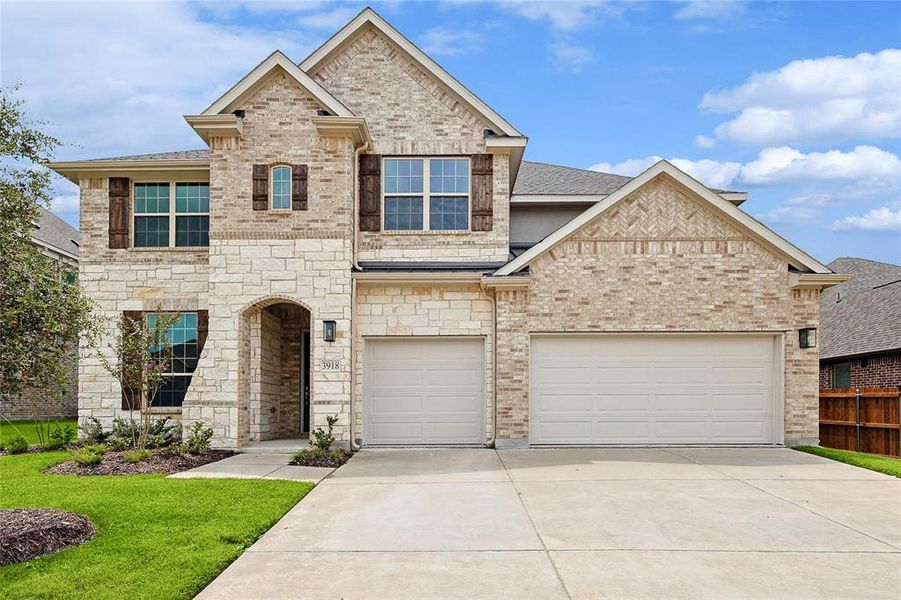 View of front of property with a garage