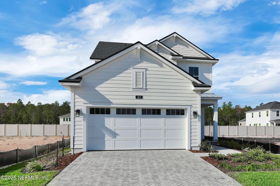 Front exterior of a new home in Seabrook Village at Seabrook, Ponte Vedra, FL, highlighting curb appeal (Image 23).