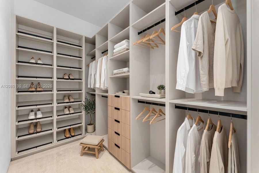 Guest Closet. Disclaimer: Several photographs presented in this listing contain digitally added furniture, artwork, and decor. These virtually staged images are intended solely for illustrative purposes.