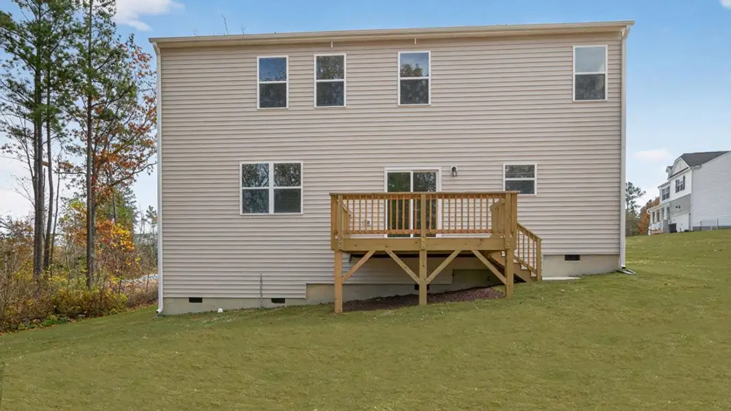 Exterior details and patio area of a home in Mason Ridge, Spring Lake (Image 4).