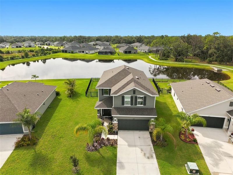 Front exterior of a new home in Aviary at Rutland Ranch, Parrish, FL, highlighting curb appeal (Image 21). Front exterior of a new home in Aviary at Rutland Ranch, Parrish, FL, highlighting curb appeal (Image 21).