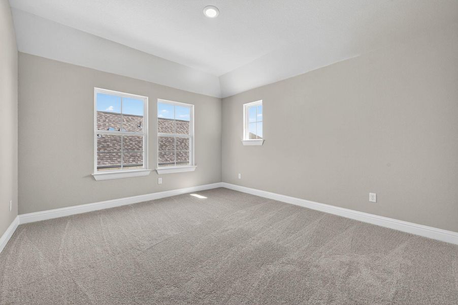 Spare room featuring light colored carpet and recessed lighting