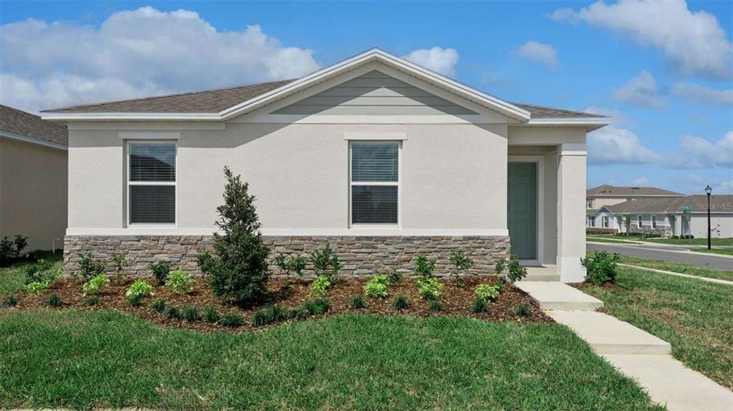 Front exterior of a new home in Crossroads at Kelly Park, Apopka, FL, highlighting curb appeal (Image 1). Front exterior of a new home in Crossroads at Kelly Park, Apopka, FL, highlighting curb appeal (Image 1).