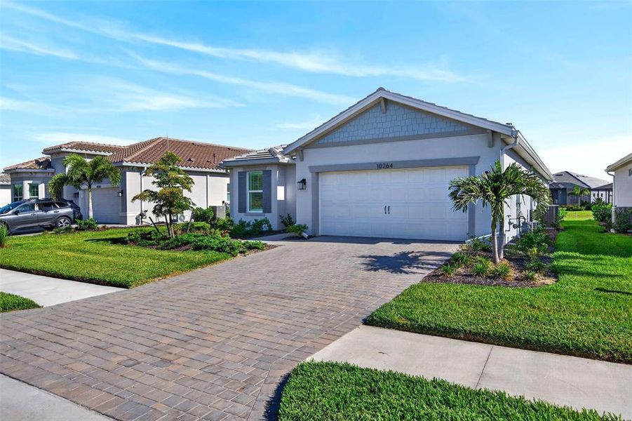 Front exterior of a new home in , Englewood, FL, highlighting curb appeal (Image 23).