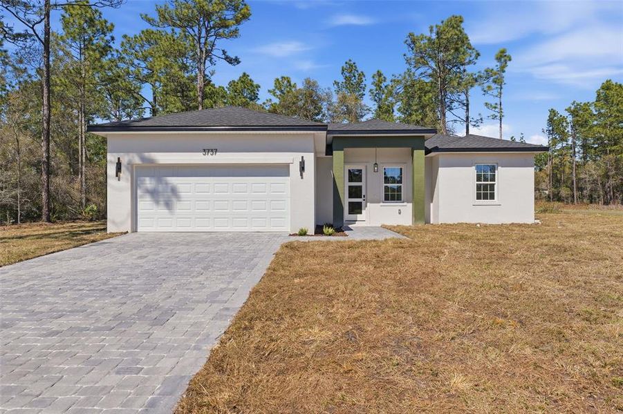Front exterior of a new home in , Citrus Springs, FL, highlighting curb appeal (Image 22). Front exterior of a new home in , Citrus Springs, FL, highlighting curb appeal (Image 22).