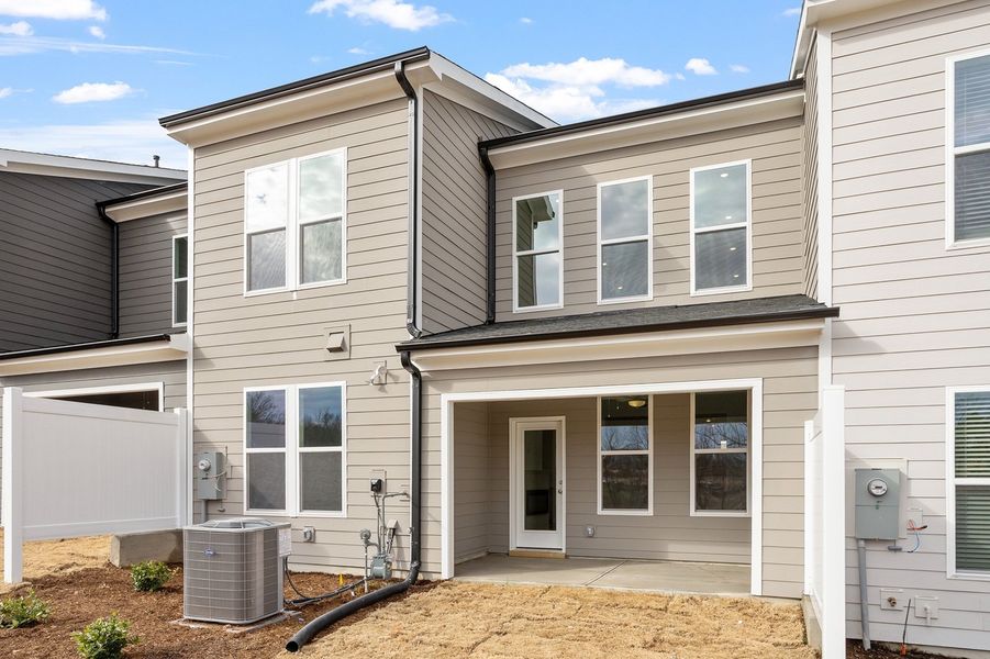 Exterior details and patio area of a home in Ovation at Sweetbrier, Durham (Image 22).
