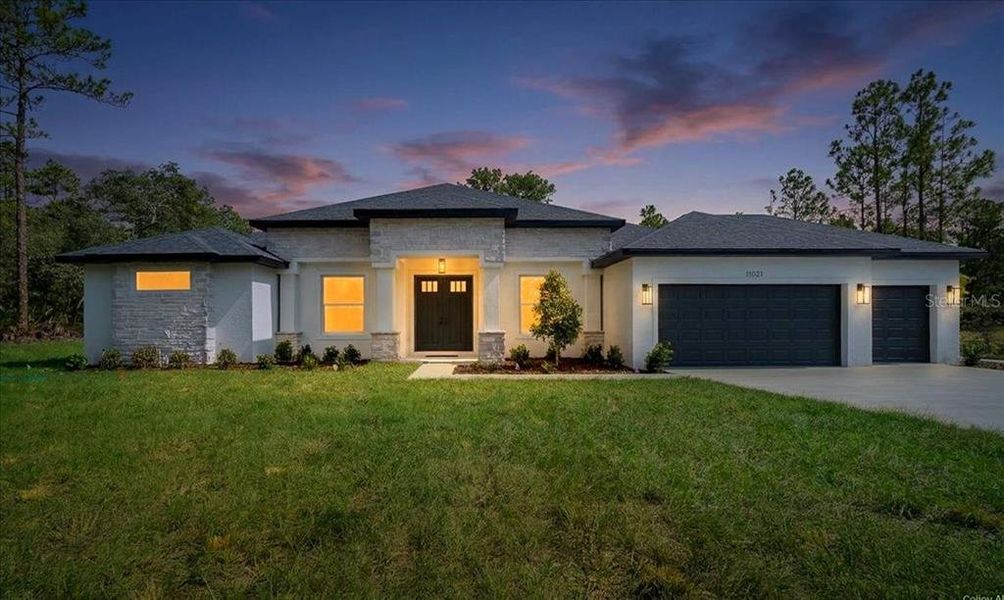 Front exterior of a new home in , Weeki Wachee, FL, highlighting curb appeal (Image 29). Front exterior of a new home in , Weeki Wachee, FL, highlighting curb appeal (Image 29).