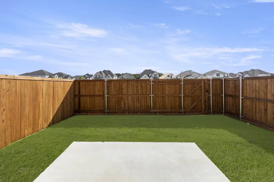 Exterior details and patio area of a home in Wildridge, Oak Point (Image 3).