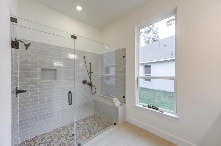 This master ensuite boasts a spacious, modern glass-enclosed shower with elegant tilework and a serene view, offering a perfect blend of luxury and comfort. This master ensuite boasts a spacious, modern glass-enclosed shower with elegant tilework and a serene view, offering a perfect blend of luxury and comfort.