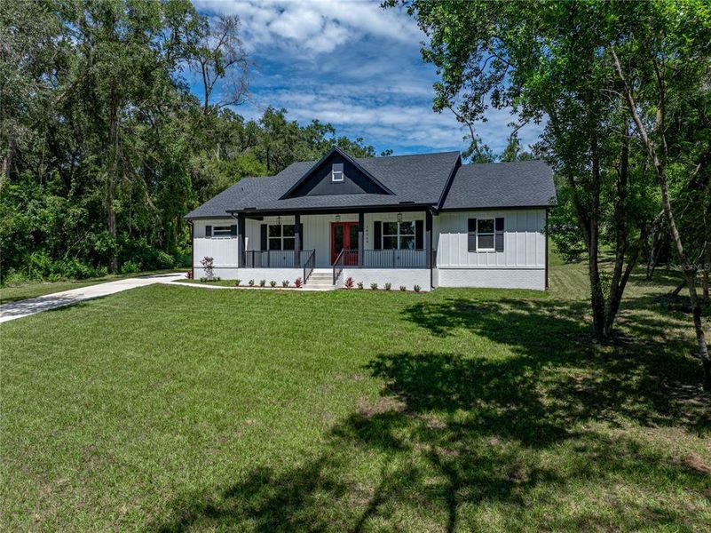 Front exterior of a new home in , Dade City, FL, highlighting curb appeal (Image 23). Front exterior of a new home in , Dade City, FL, highlighting curb appeal (Image 23).