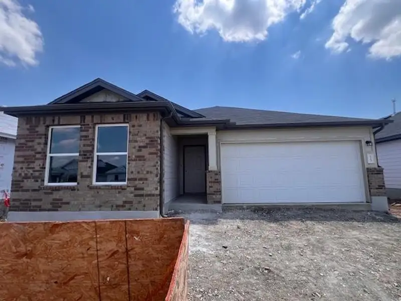 Front exterior of a new home in Marble Creek Crossing, Austin, TX, highlighting curb appeal (Image 1). Front exterior of a new home in Marble Creek Crossing, Austin, TX, highlighting curb appeal (Image 1).