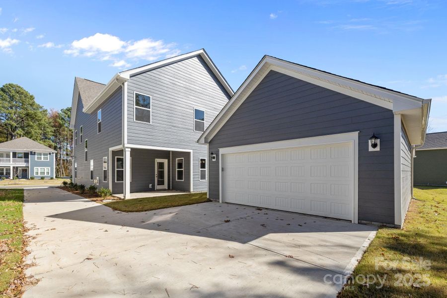 Front exterior of a new home in Arbor Village, Matthews, NC, highlighting curb appeal (Image 16).