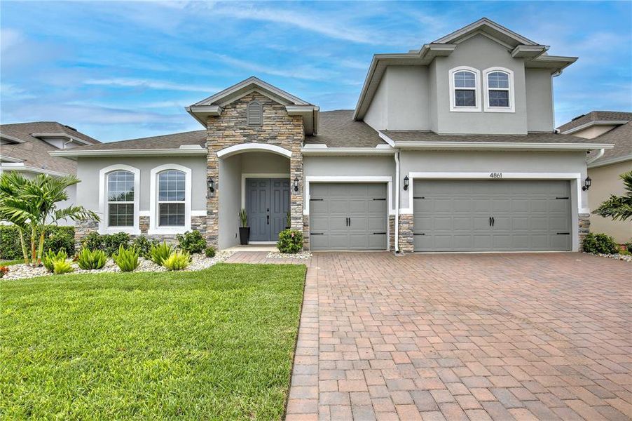 Front exterior of a new home in , Clermont, FL, highlighting curb appeal (Image 26). Front exterior of a new home in , Clermont, FL, highlighting curb appeal (Image 26).