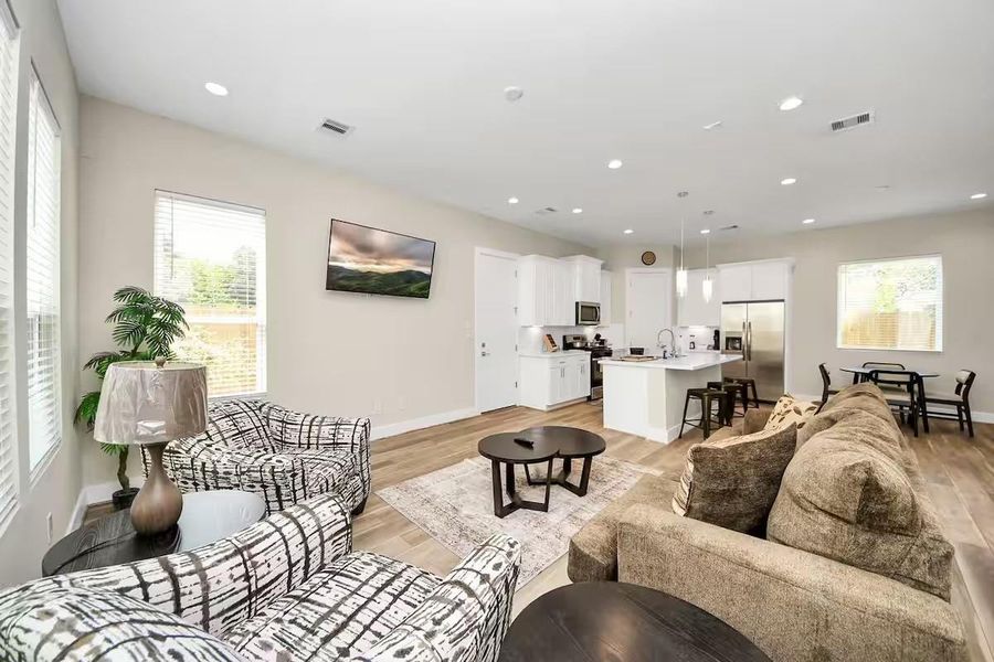 The main living space keeps everything connected, giving you an easy flow from relaxing on the couch to cooking, dining, and entertaining.