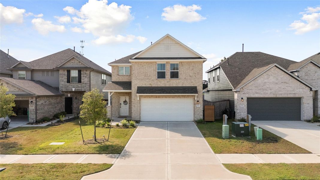 Front exterior of a new home in , Conroe, TX, highlighting curb appeal (Image 1). Front exterior of a new home in , Conroe, TX, highlighting curb appeal (Image 1).